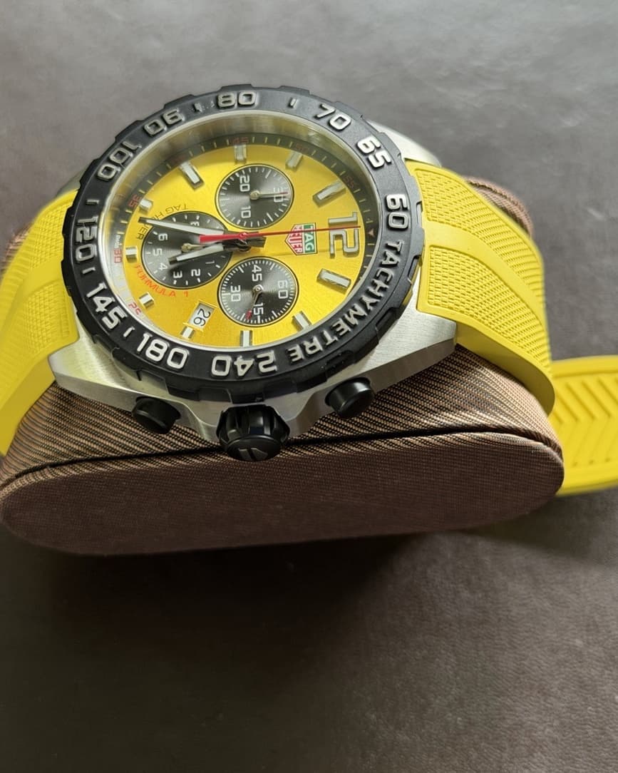 Close crop of the TAG Heuer Formula 1 yellow chronograph dial and black tachymeter bezel