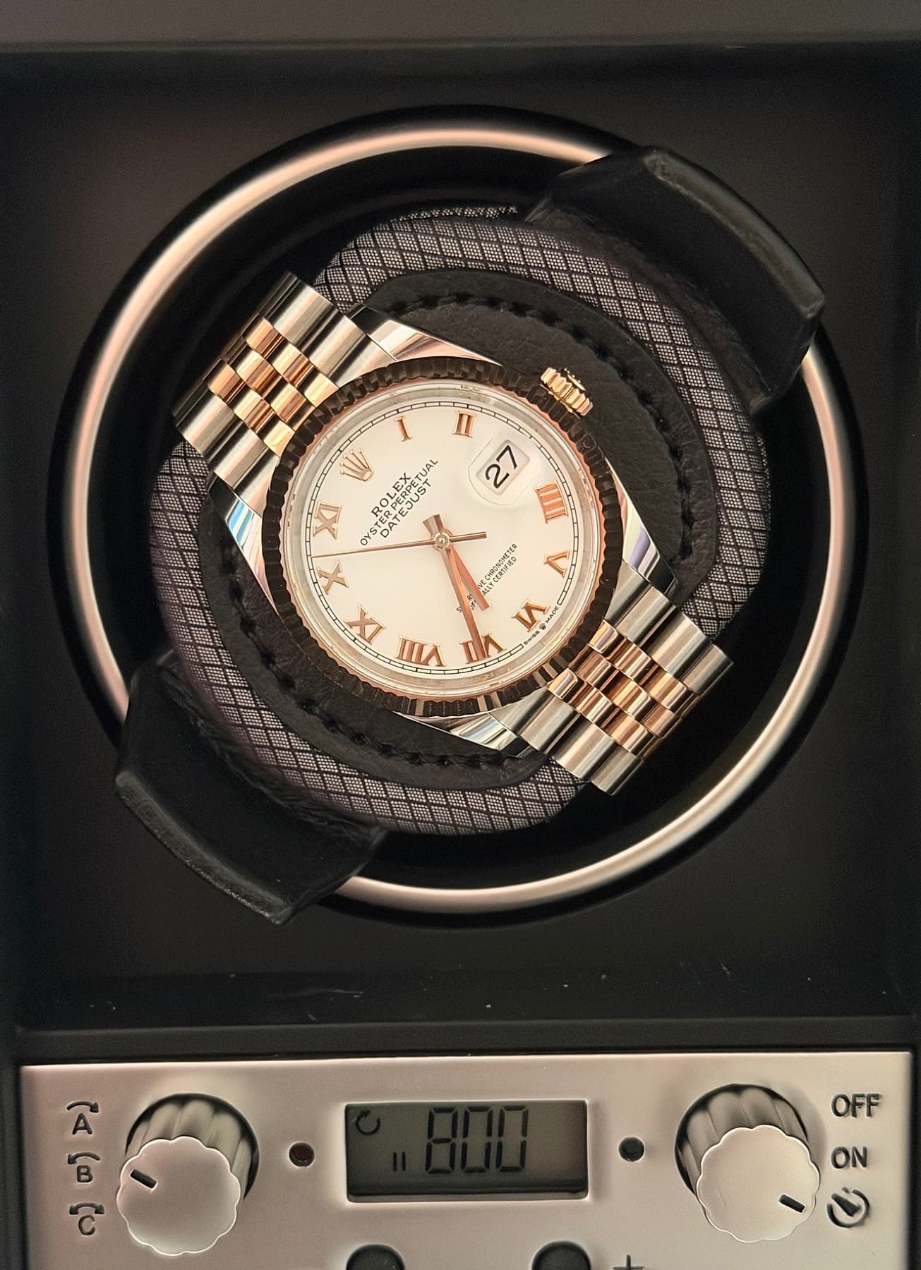 Rolex Datejust 36 reference 126231 shown on a watch winder