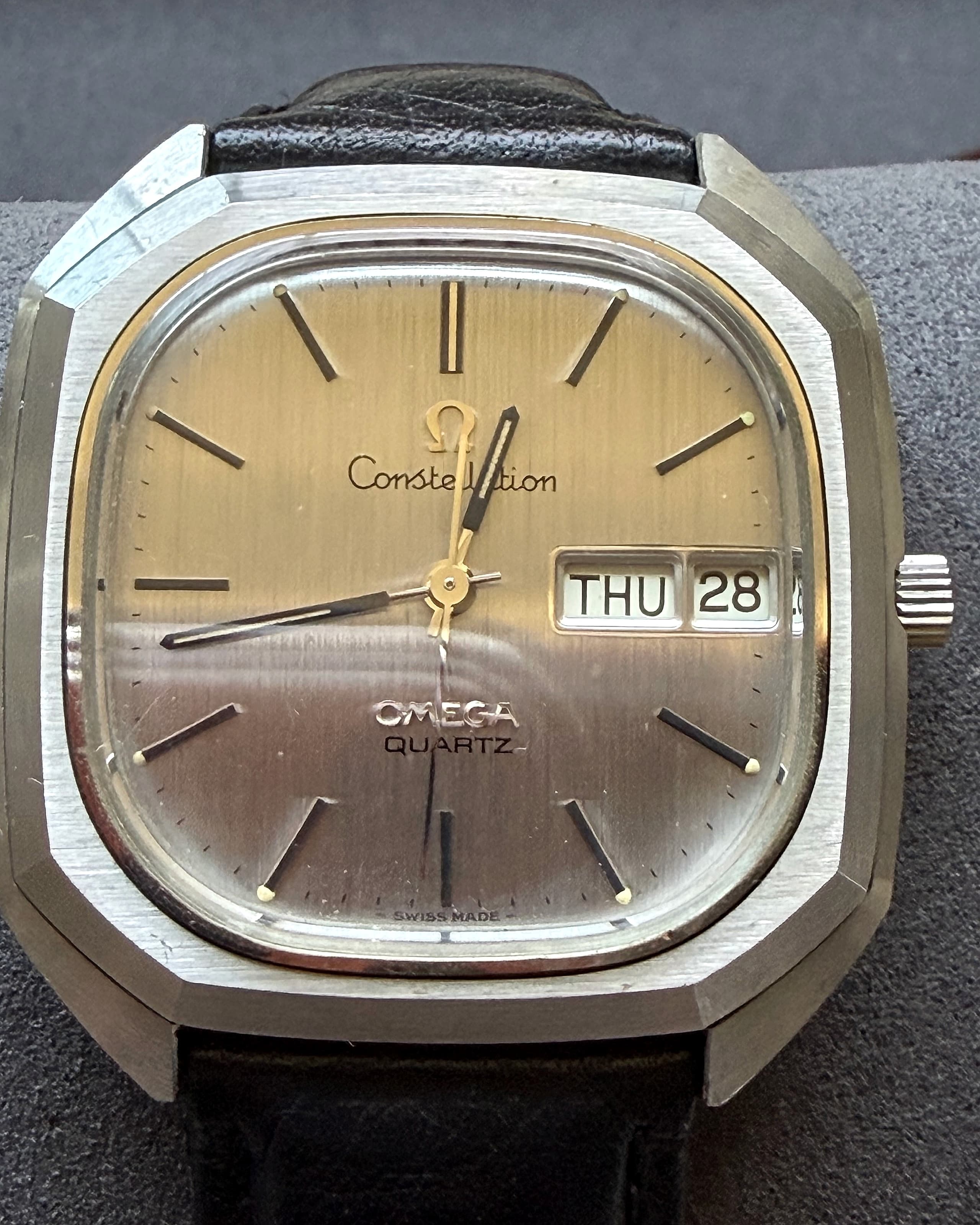 Close dial detail of the 1976 Omega Constellation Megaquartz day-date with brushed silver finish and day-date window